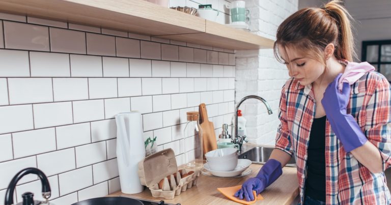 woman-cleaning-kitchen